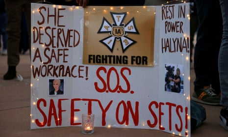 A sign calling for workplace safety at a vigil for the cinematographer Halyna Hutchins.