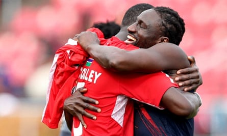 Omar Colley celebrates with a Gambia teammate