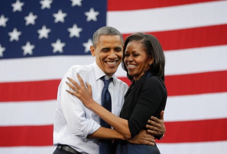 Michelle Obama 2.0 – the reinvention of the former first lady Michelle and Barack Obama embrace in front of an American flag
