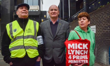 RMT general secretary Mick Lynch with striking workers on the picket line at Euston station, London
