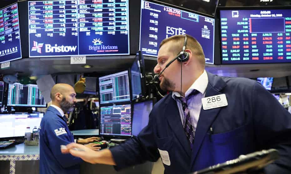 Traders work on the floor of the New York Stock Exchange (NYSE) on October 15, 2018.