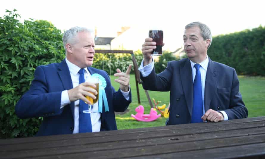 Mike Greene and Nigel Farage have a drink at The Bull public house in Newborough before votes were counted.