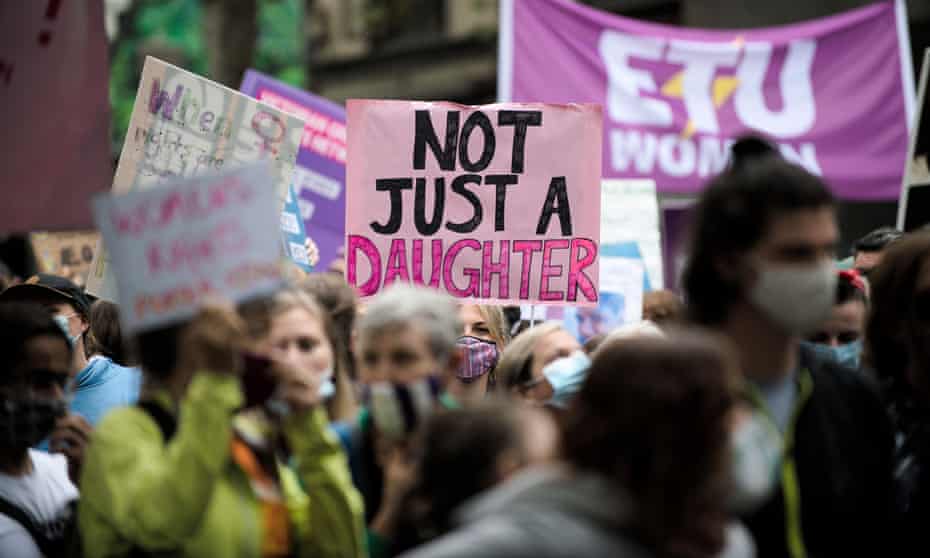 A protester with a sign that reads ‘Not just a daughter’ at a rally on International Women’s Day in Melbourne. March 4 Justice protests will be held across Australia on Monday.