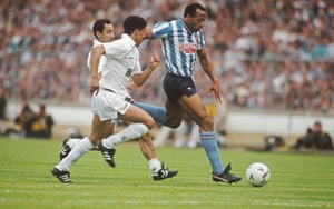 Coventry striker Cyrille Regis surges past Spurs players Osvaldo Ardiles (left) and Chris Hughton.