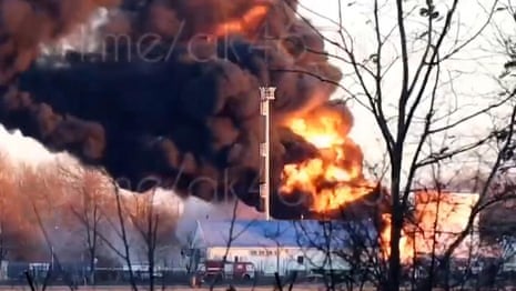 Russia: drone attack sets oil storage tank alight on Kursk airfield – video