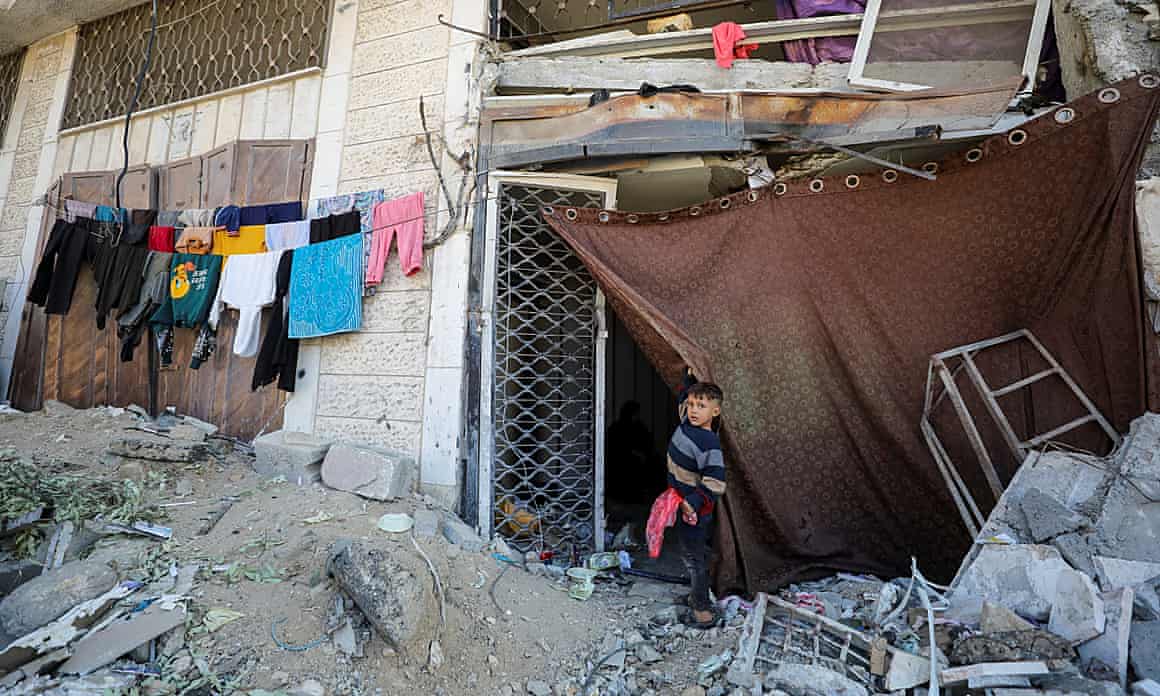 A child outside a makeshift home