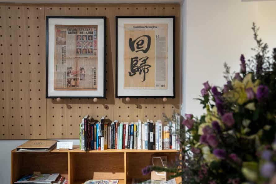 Two newspaper front pages on the wall of a bookshop