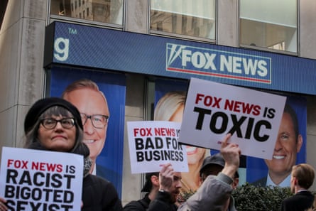 Protesters gather outside of Fox News in New York.