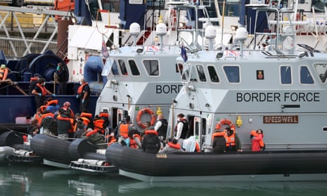Migrants in lifejackets on boats