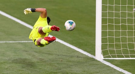 Young makes a save during his time with Brisbane Roar.