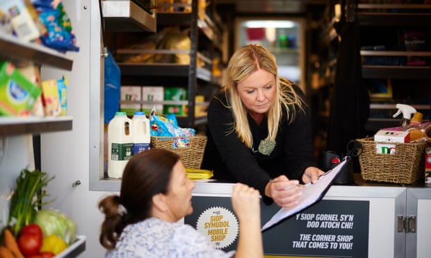 Laura Hankey serves a customer at Well Fed’s mobile shop.