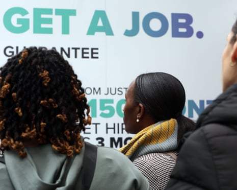 Young people looking at signage at the event