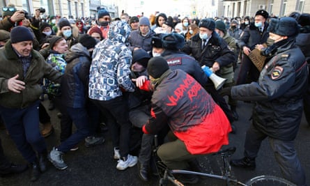 Protesters scuffle with police during a rally in Vladivostok