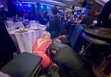 Guests take cover after US President Donald Trump and first lady Melania Trump were rushed out of the White House Correspondents’ Association dinner by Secret Service agents after a loud, unidentified noise.