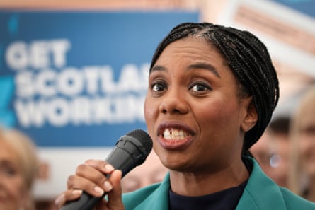 Kemi Badenoch with a microphone on the campaign trail