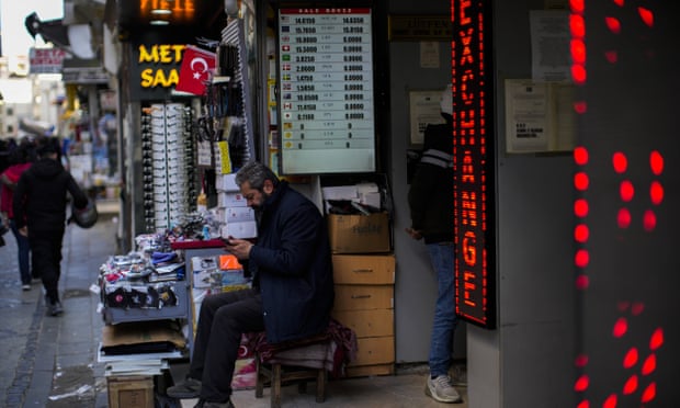 A screen displays exchange rates in a currency exchange shop in a commercial street in Istanbul, Turkey.