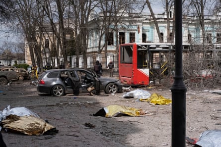 Bodies lie on the ground after the Russian missile strike on Sumy
