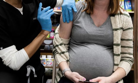 A pregnant woman receives a Covid vaccine in Pennsylvania. 