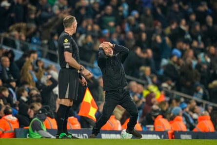Pep Guardiola with his hands on his head