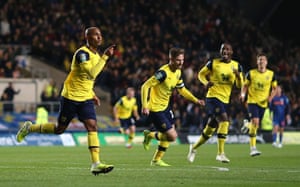 Rob Hall celebrates scoring the opening goal at the Kassam Stadium.