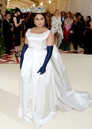 Her silver gown and navy opera-length gloves may have been channeling classic princess style but Mindy Kaling's dramatic gold crown, by Greek jewelry designer Pericles Kondylatos, was all queen.