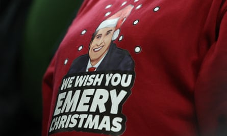 An Aston Villa fan wears an Unai Emery tribute jumper.