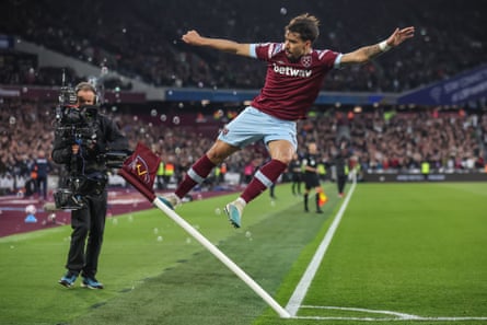 Lucas Paquetá of West Ham United celebrates after scoring the opening goal in the Premier League match against Liverpool.