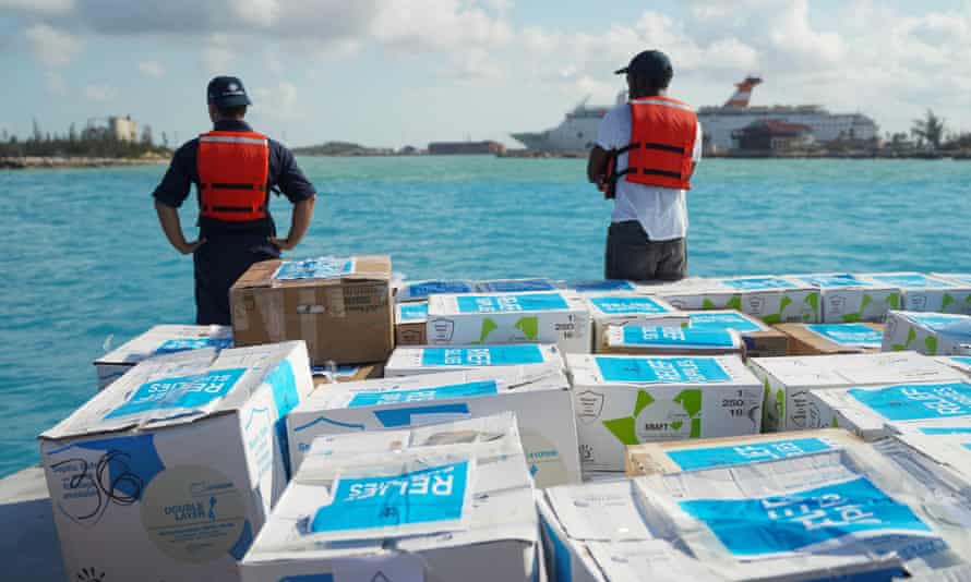 Crew members from Royal Caribbean Cruise Line’s Symphony of the Seas, the world largest cruise ship, load humanitarian aid for residents of Grand Bahama top be delivered from Nassau.