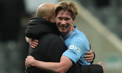 Kevin De Bruyne gets a hug from Pep Guardiola for his match-winning show for Manchester City against Newcastle