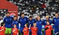 Players of Italy and mascots sing the national anthem