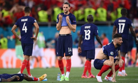 Players of France look dejected after team-mate Kylian Mbappe misses.