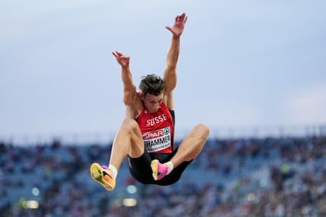 Simon Ehammer flies through the air during the men's long jump final.