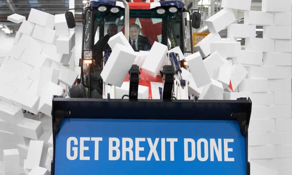 Boris Johnson drives a JCB through a fake wall during the election campaign. JCB-linked companies gave his party more than £3.2m.
