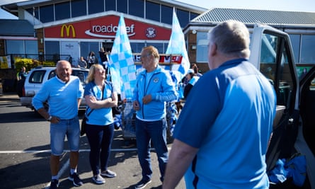 Manchester City fans in the car park outside the front entrance