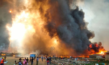 Smoke billows at the site of the Rohingya refugee camp where fire broke out in Cox’s Bazar, Bangladesh, March 22, 2021. REUTERS/Stringer NO RESALES. NO ARCHIVES