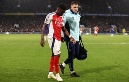 Bukayo Saka leaves the pitch after picking up an injury in the second half
