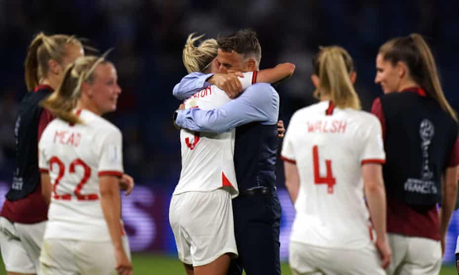 Phil Neville hugs England captain Steph Houghton after the 3-0 win over Norway.