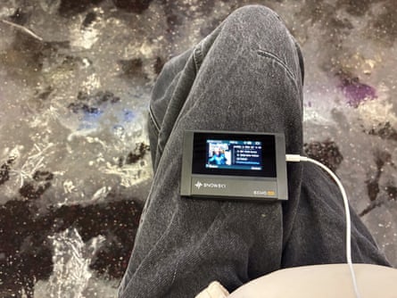 A person using a SnowSky/FiiO Echo MP3 player