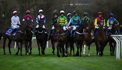 The runners ands riders prepare for the start of the opening race at the Cheltenham festival.