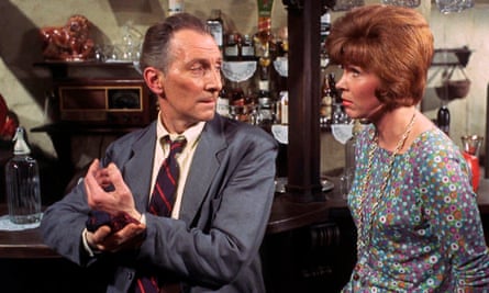 Sarah Lawson and Peter Cushing in the 1967 film thriller Night of the Big Heat.