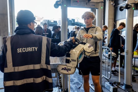 NFL Academy linebacker Terho Vainio from Finland passes through security at the Tottenham Hotspur Stadium before their match against De La Salle Spartans from California.
