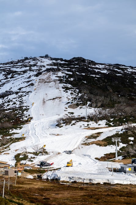 Many of the ski lifts are idle at Perisher Blue Ski Resort in NSW due to a lack of natural snow.