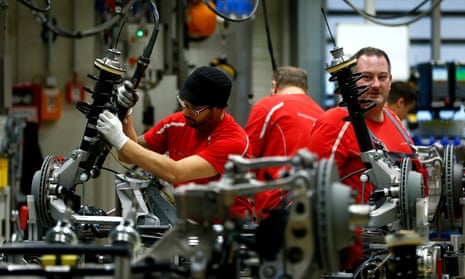 Employees of German car manufacturer Porsche working at the Porsche factory in Stuttgart-Zuffenhausen, Germany.