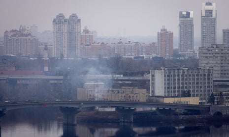 smoke rises from building in Kyiv on 24 February