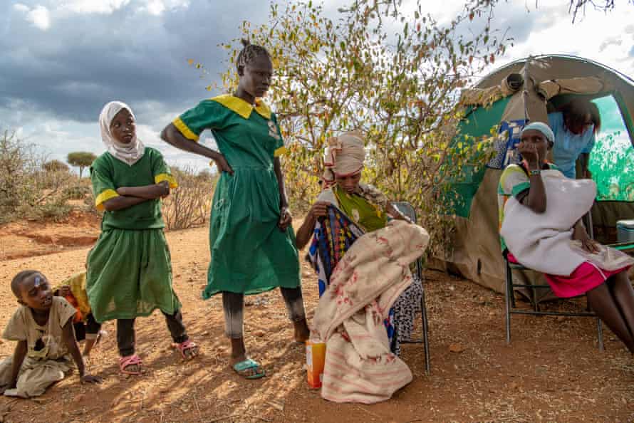 Women and girls attend the healthcare clinic.