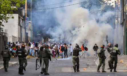 Riot police clash with demonstrators protesting against the government of Nicolás Maduro on Wednesday.