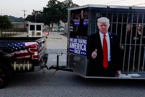 A vehicle and trailer drive by the Fulton County Jail.