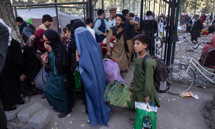 Displaced Afghans from northern provinces are evacuated from a makeshift camp to various mosques and schools in Kabul