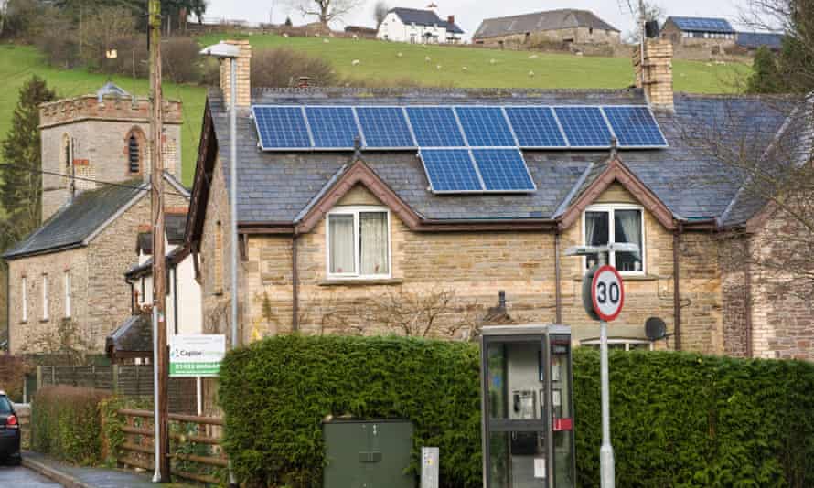 Solar panels fitted to roof of rural detached period in Wales