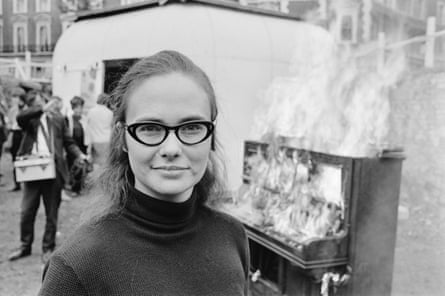 Annea Lockwood in October 1968. In the background, a burning piano from which Lockwood is making a live recording.
